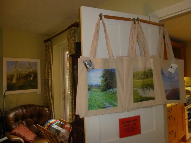 Cotton tote bags hanging on the door